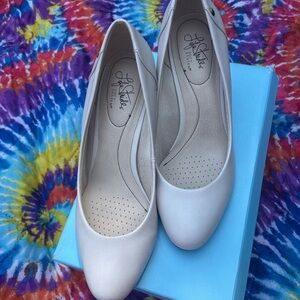 Women’s Lifestyles low heel cream leather pumps.